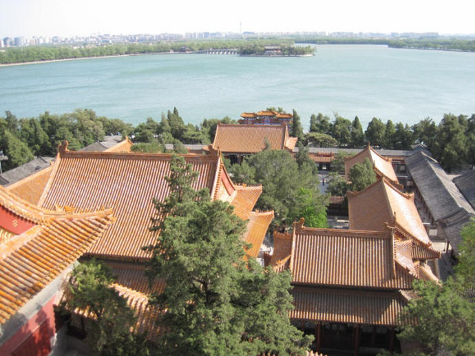 City skyline behind the lake while overlooking the Summer Palace from the top of the Tower of the Fragrance of the Buddha