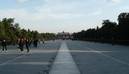 Long walkway betwen temples through the park